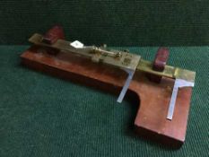 An early twentieth century precision measure by Troughton and Simms of London in fitted mahogany