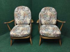 A pair of Ercol elm armchairs