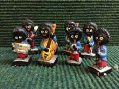 A set of eight Robinson Golly musicians