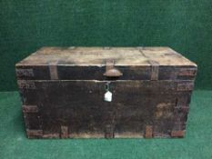 An antique mahogany blanket chest with metal mounts