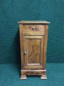 A walnut pot cupboard fitted a drawer