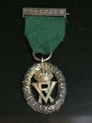 A silver Volunteer decoration in Garrards box