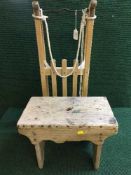 An antique pine cracket together with a wooden sledge