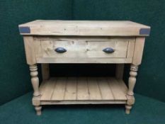 A pine butchers block fitted a drawer