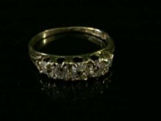 An 18ct gold five stone diamond ring