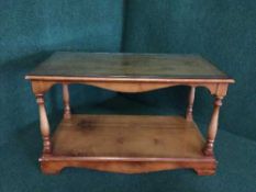 A yew wood and glass topped coffee table