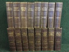 A crate of sixteen leathern bound Dickens volumes