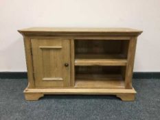 A light oak contemporary entertainment stand