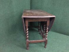 An oak barley twist gate leg table