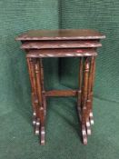 A nest of three mahogany tables