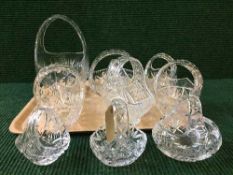A tray of ten lead crystal baskets, various sizes.