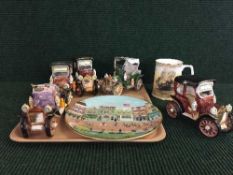 A tray of five china car figures, Royal doulton El Alamein tankard,