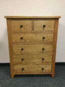 A light oak contemporary six drawer bedroom chest