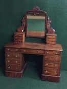 A Victorian mahogany dressing table with glass handles
