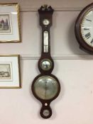 A nineteenth century mahogany banjo barometer with silvered dial