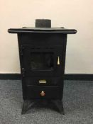 A cast iron log burner by Prity