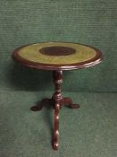 A leather topped lamp table