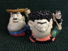Two Royal Doulton character jugs : Dennis and Gnasher D7033 together with Desperate Dan D7034