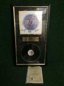 A framed Bee Gees montage,