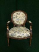 A carved salon armchair