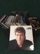 A box of lp's including John Lennon, Dire Straits,