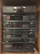 A Sony five piece separate system in cabinet with speakers