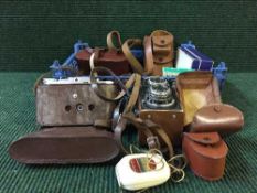 A box of cameras, Helina Ai camera in leather case, Voigtlander, Stereographic camera,