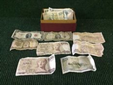 A box of assorted coins, mostly American, together with sixteen assorted banknotes, American,