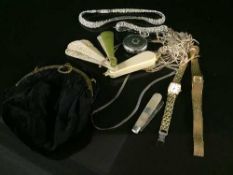 A tin containing: a pocket watch, two ladies wristwatches, costume necklace and bracelet,
