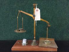 A small set of brass scales with graduated weights