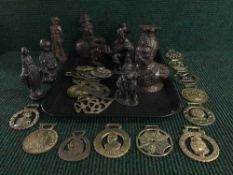 A tray of assorted horse brasses,