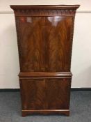A reproduction mahogany cocktail cabinet