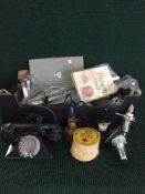Two boxes of beer mats, bar optics, bakelite telephone,