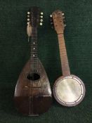 A bowl backed mandolin and miniature banjo