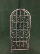 A metal domed topped wine rack