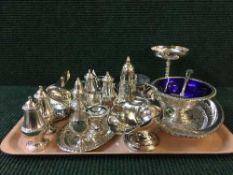 A tray of assorted silver plated items, coasters, cruet set, butter dish etc.