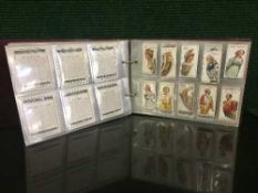 A bound folio of cigarette cards relating to sea travel : Merchant Ships of the World by Wills,