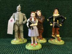 Four Royal Doulton Wizard of Oz Figures comprising of Tin Man, Dorothy,