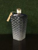 A blue glazed jug with sterling silver mount