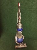 A Dyson DC25 upright vac