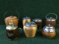 A tray of seven wooden tea caddies