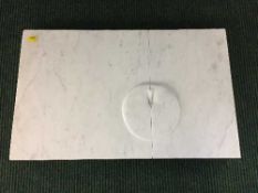 A white marble plaque titled Golden Apple by Neil Talbot