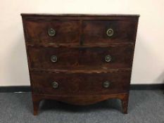An early nineteenth century mahogany bow fronted chest of four drawers