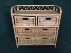 A bamboo and wicker four drawer chest