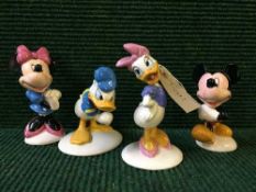 Four Royal Doulton Mickey Mouse collection figures - Mickey Mouse, Minie Mouse, Daisy Duck,