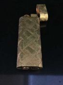 A gold plated Cartier cigarette lighter