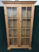 A pine double door bookcase