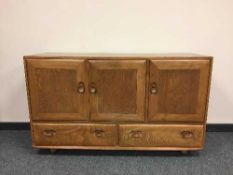 An Ercol elm sideboard