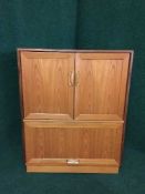 A mid 20th century teak TV cabinet