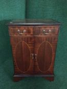 An inlaid mahogany audio cabinet